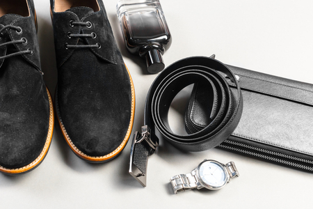 shoes and accessories for men lay on the wooden floorの写真素材