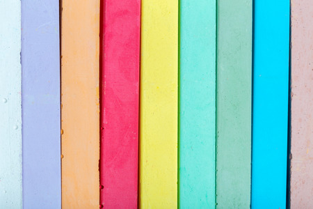 chalks in a variety of colors arranged on a white background