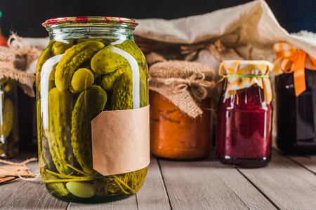 Preserved vegetables on wooden backgroundの写真素材
