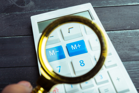 Calculator and magnifying glassの写真素材