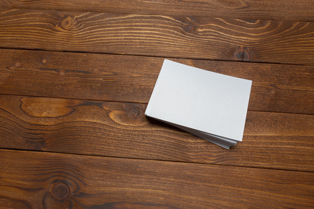 blank white business cards on wooden background.の写真素材