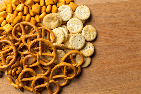 Salty snacks. Pretzels, chips, crackersの写真素材