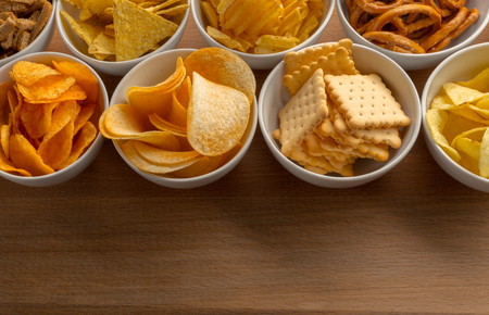 Pretzels in bowls on wooden table from aboveの写真素材