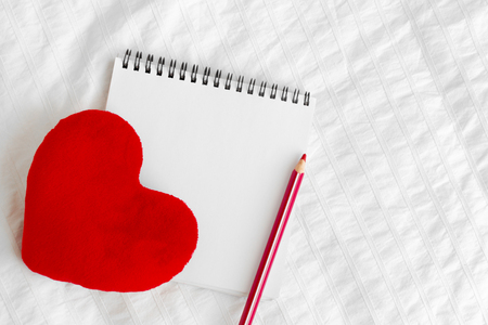 Red heart and notebookの写真素材