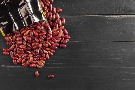 Red beans on wooden table