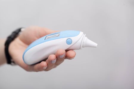 Sick women with a thermometer