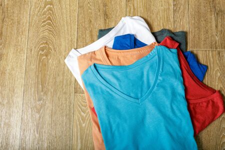 colorful shirts on tableの写真素材