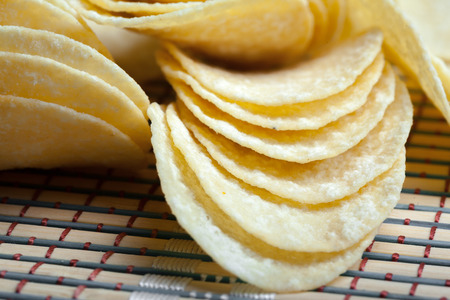 Potato chips in bowl on a table