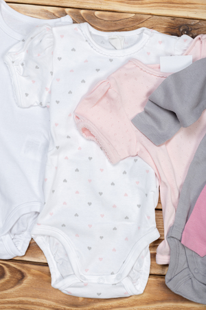 Baby stuff on wooden tableの写真素材