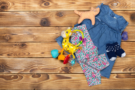 Baby stuff on wooden tableの写真素材
