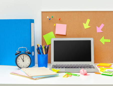 Work place of a creative person with a variety of colorful stationery objectsの写真素材