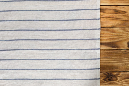 Background with empty wooden table with tablecloth