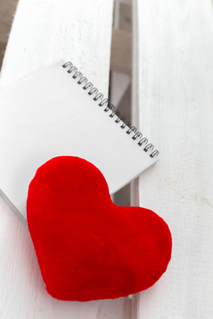 Red heart and notebookの写真素材