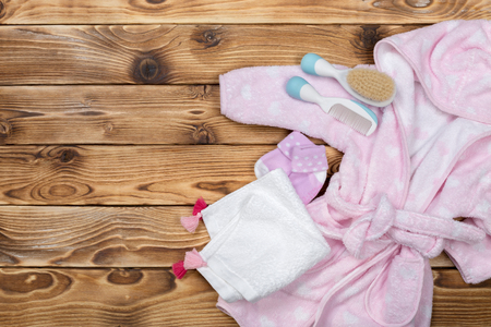 Baby stuff on wooden tableの写真素材