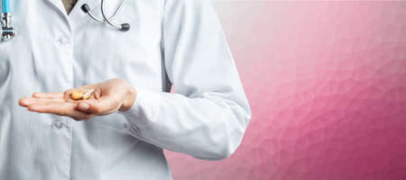 Doctor holding pillsの写真素材