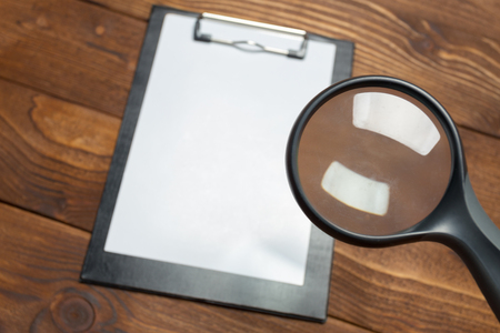 white paper clipboard on wood backgroundの写真素材