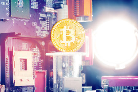 Bitcoin and a computer graphic cardの写真素材