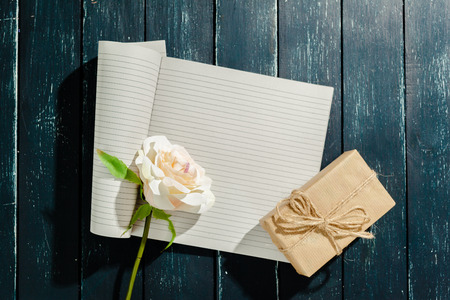 flowers with empty vintage notebook for your designの写真素材