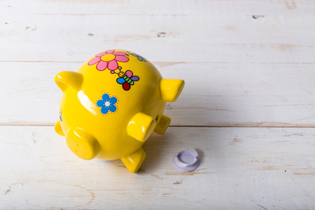 Piggy bank on wood table topの写真素材