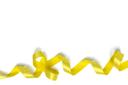 Yellow ribbons isolated on whiteの写真素材