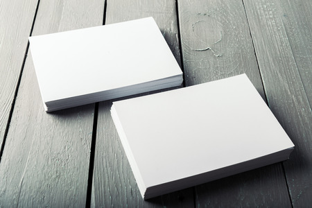 blank business cards on a wooden background