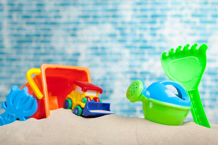 Children's toys on sandの写真素材