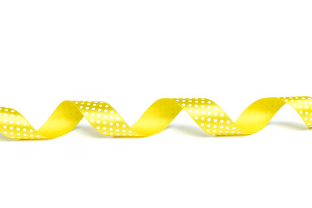 Yellow ribbons isolated on whiteの写真素材
