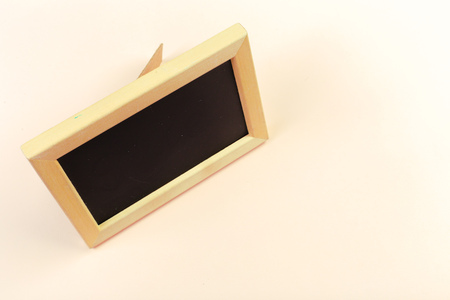 Small wooden framed blank blackboard for your designの写真素材
