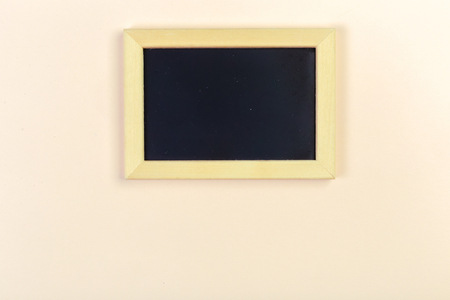 Small wooden framed blank blackboard for your designの写真素材