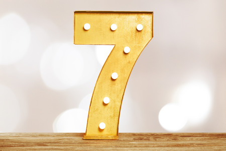 Big plastic numbers with shining light bulbsの写真素材