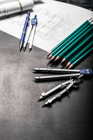 Construction planning drawings on black background