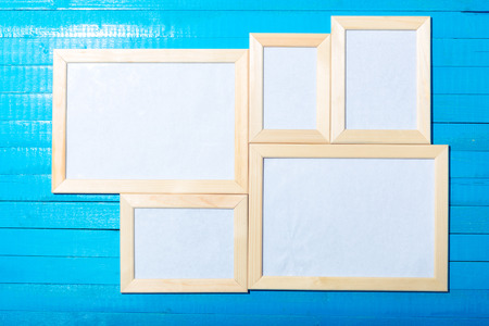 photo frames on the wooden wallの写真素材