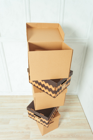 Big cardboard boxes standing insinde a room