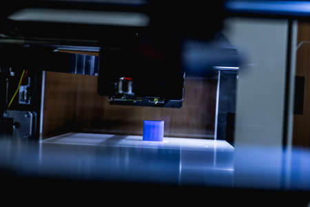 head of 3d printer in actionの写真素材