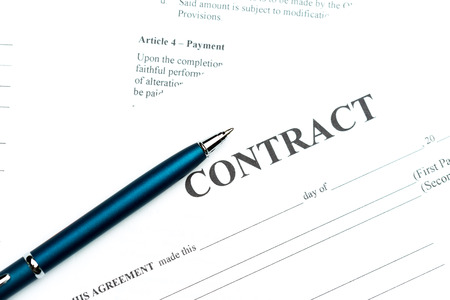 Close-up of pen on contractの写真素材