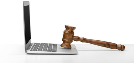 Laptop And Mallet On Tableの写真素材