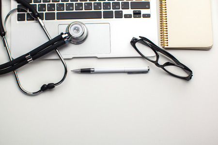 Medical stethoscope on computer keyboardの写真素材