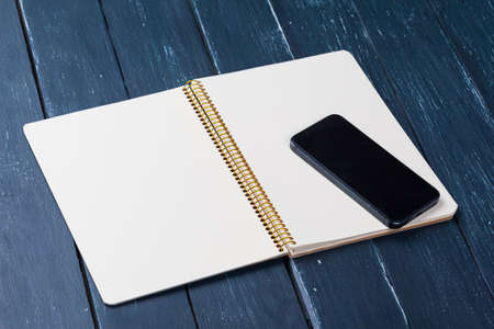 Blank note book on table, top view