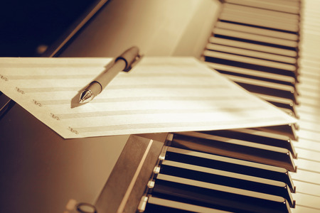 music notes on piano keysの写真素材