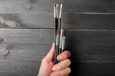 Hand  with brushesの写真素材