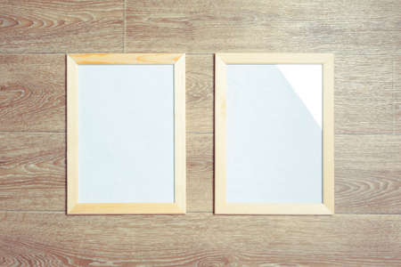 photo frames on the wooden wall