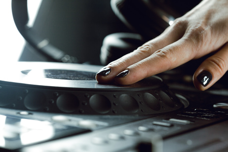 DJ playing music at mixer closeupの写真素材