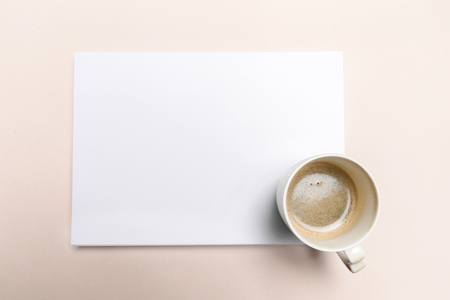 Blank paper  on top of pink pastel deskの写真素材