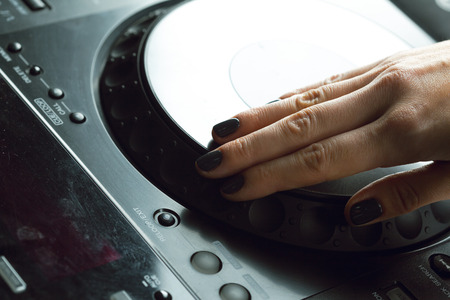 DJ playing music at mixer closeupの写真素材