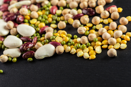 mix of beans on wooden tableの写真素材