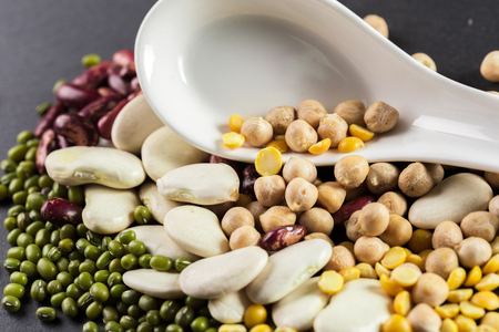 mix of beans on wooden tableの写真素材