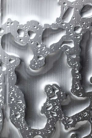 Drops of rain on the glass windowの写真素材