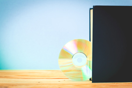 book and DVD disk as symbols of old and new methods of information storageの写真素材