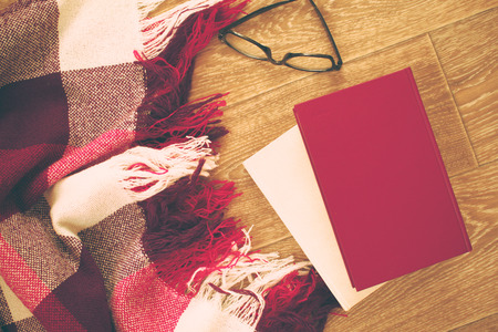 reading glasses with books on the tableの写真素材