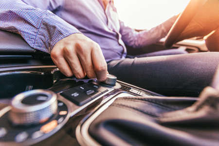 Close-up of a male hand  in a modern carの写真素材